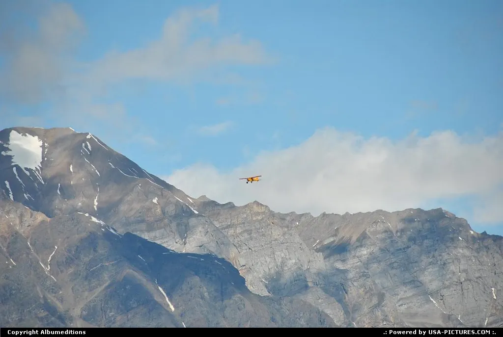 This plane appears tiny and insignificant flying past the breathtaking granite sprires...