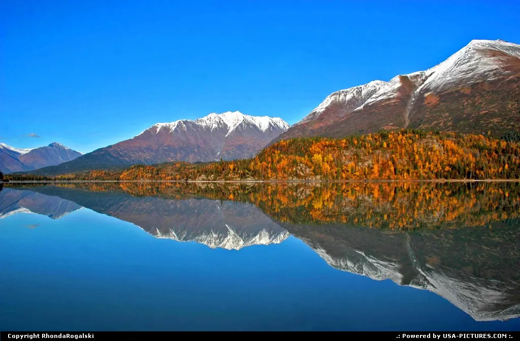 Vibrant reflection on Lower Trail Lake in Moose Pass, Alaska.