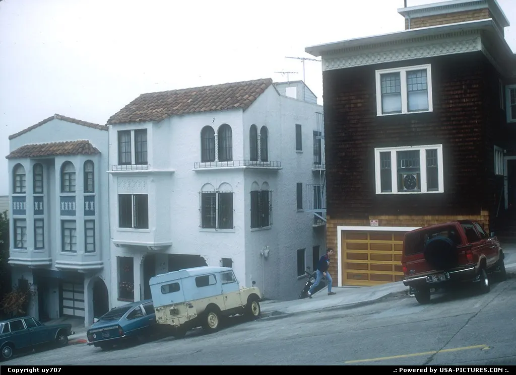 Three of countless houses built on hill sides across the city