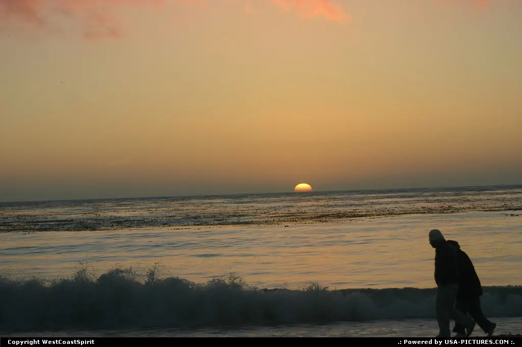 Enjoy a walk on the edge of the sea. Sunset comes as a free bonus!