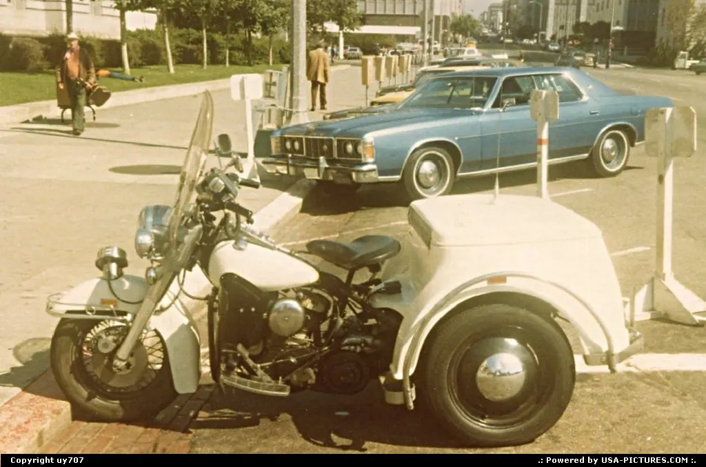 An Harley-Davidson tricycle of the police department at rest.