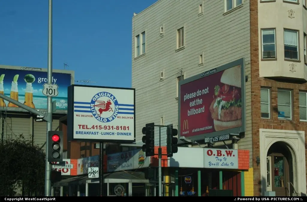Advertisements catching while waiting at the traffic light. Here on Lombard Street.