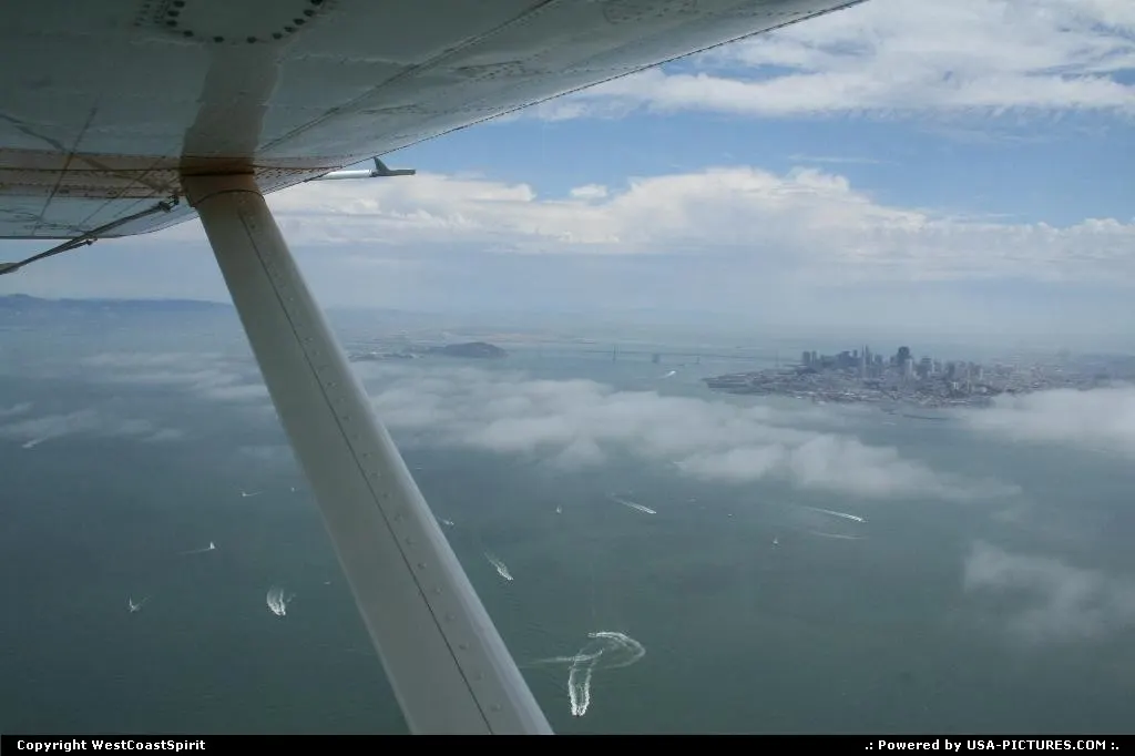 Golden Gate Bay from above with the typical fog around.