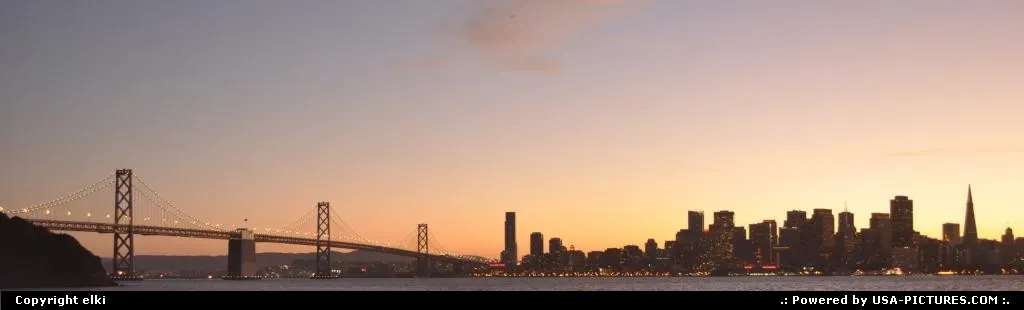 sunset over oakland bridge, and san francisco skyline
