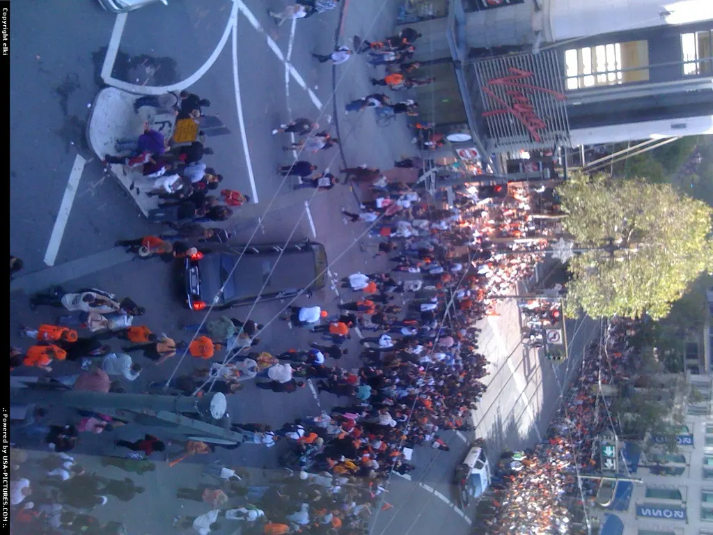 People start to gather along market street to see the parade.