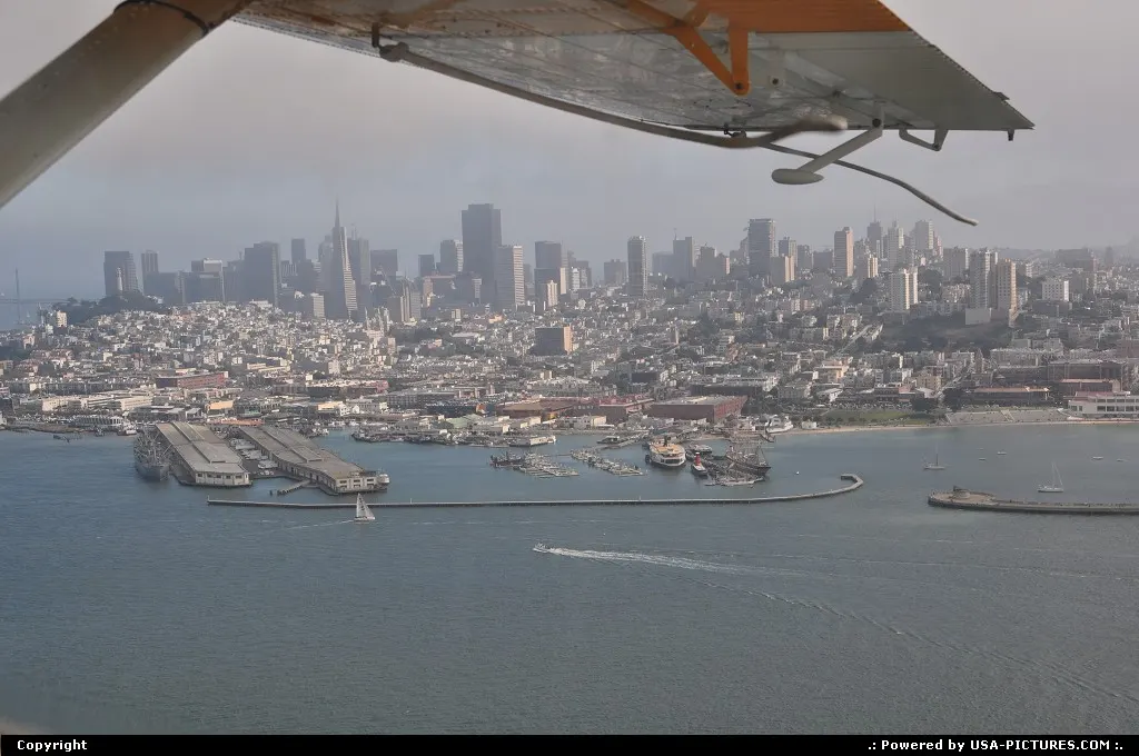 Overlooking downtown San Francisco from the seaplane, flying around bay area on a foggy...