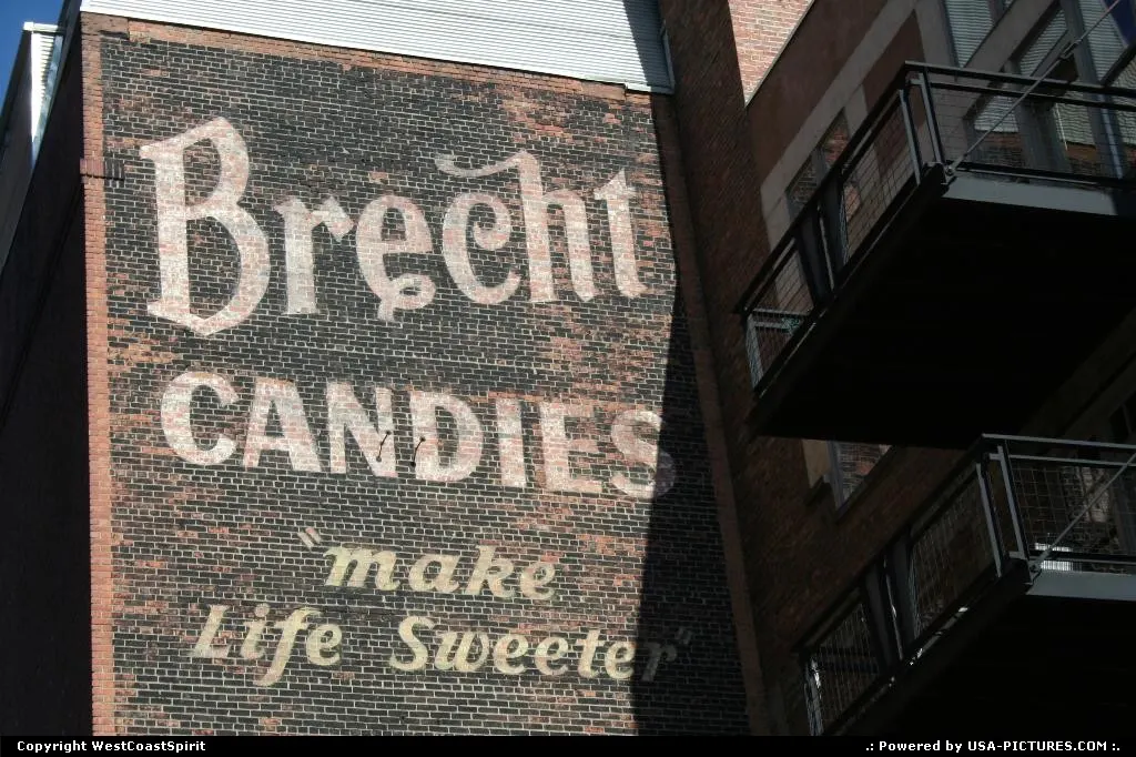 A vintage wall painting in a former brick warehouse, converted into vibrant, modern con...
