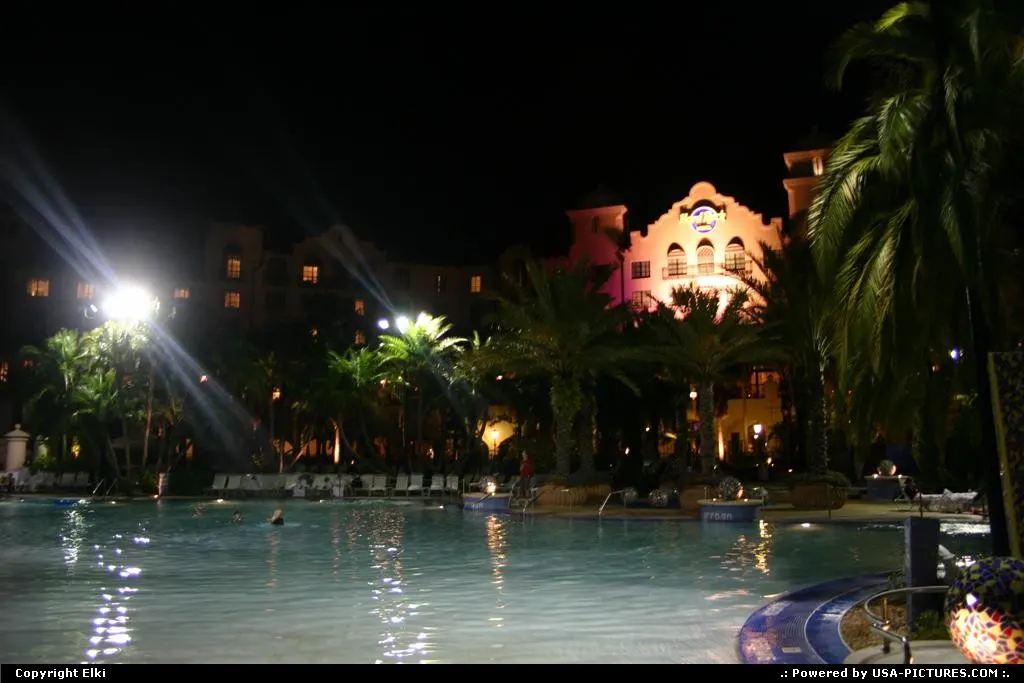 An overview of the Hard Rock Hotel pool, at night, in Orlando.