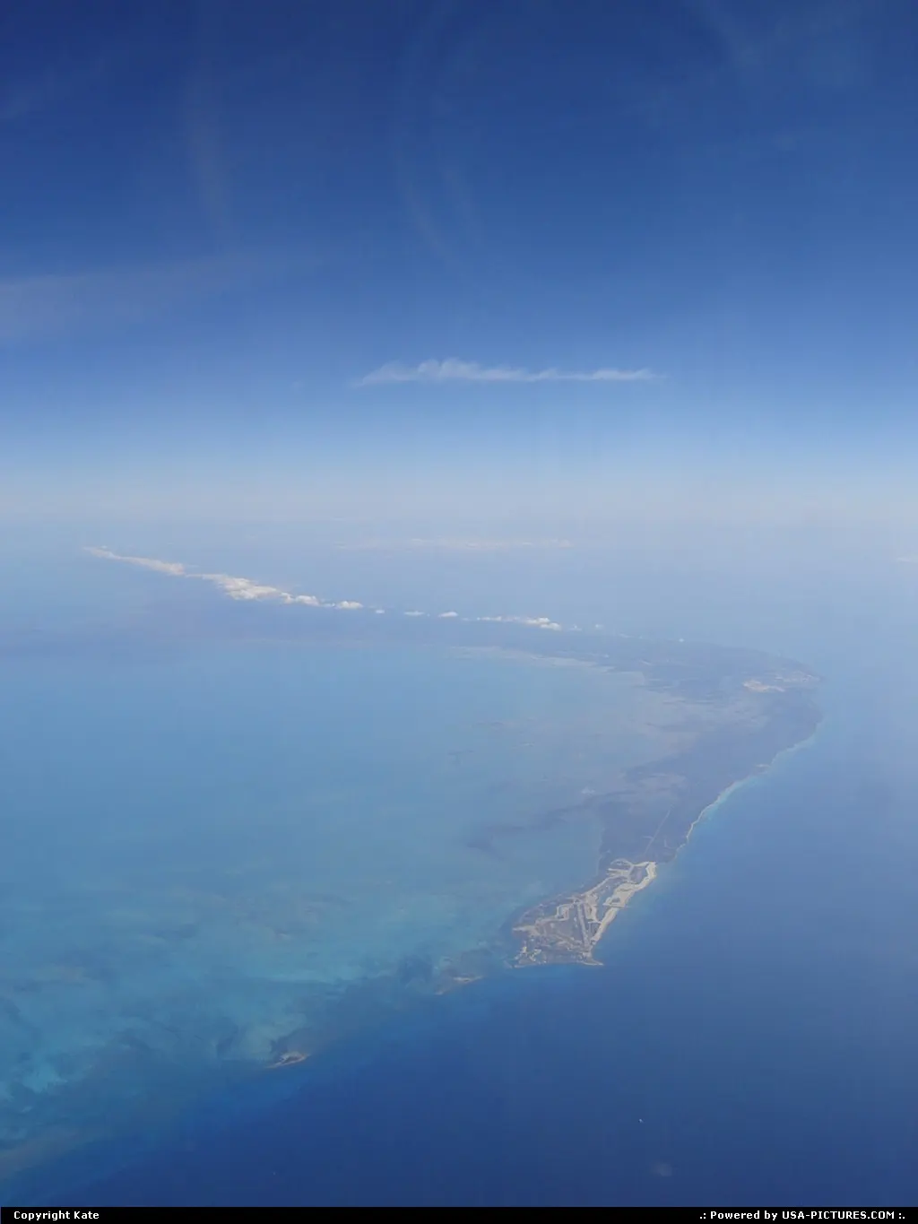 Out of Miami, a few minutes after take-off, Grand Bahama spreads on the Atlantic Ocean.