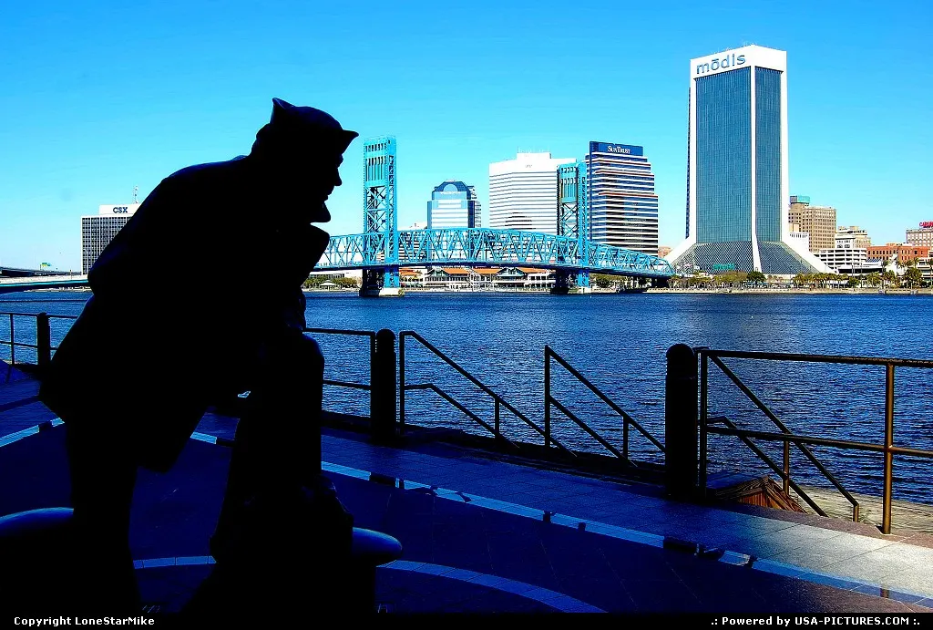 Jacksonville, FL skyline with statue of sailor in the foreground.