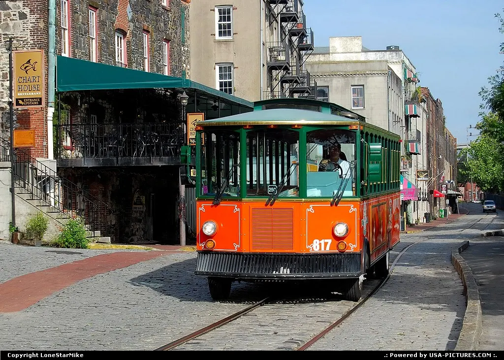 Tourist trolley in the historic district along the waterfront in Savannah, GA