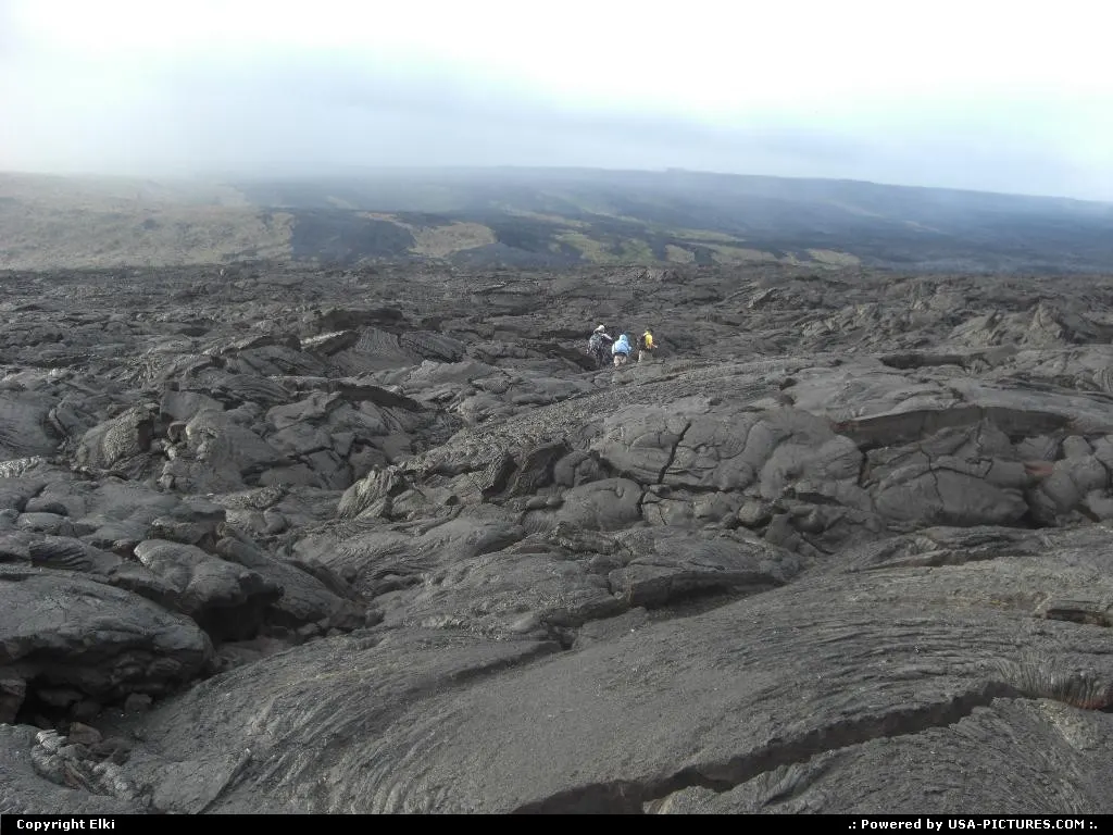 Lava streams from the hill to the sea