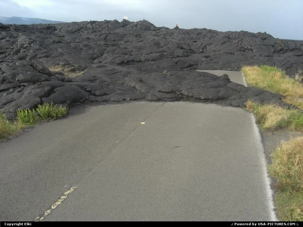 Lava stream spreading over the road