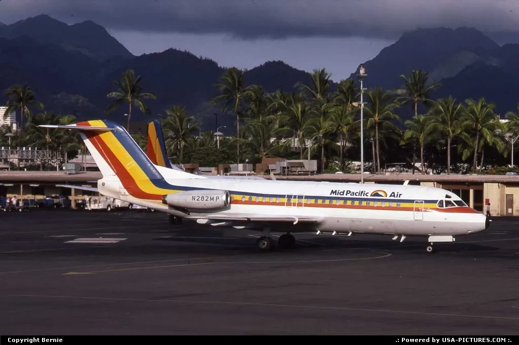 Beautiful background for this colourful Fokker 28-4000 of Mid Pacific Air
