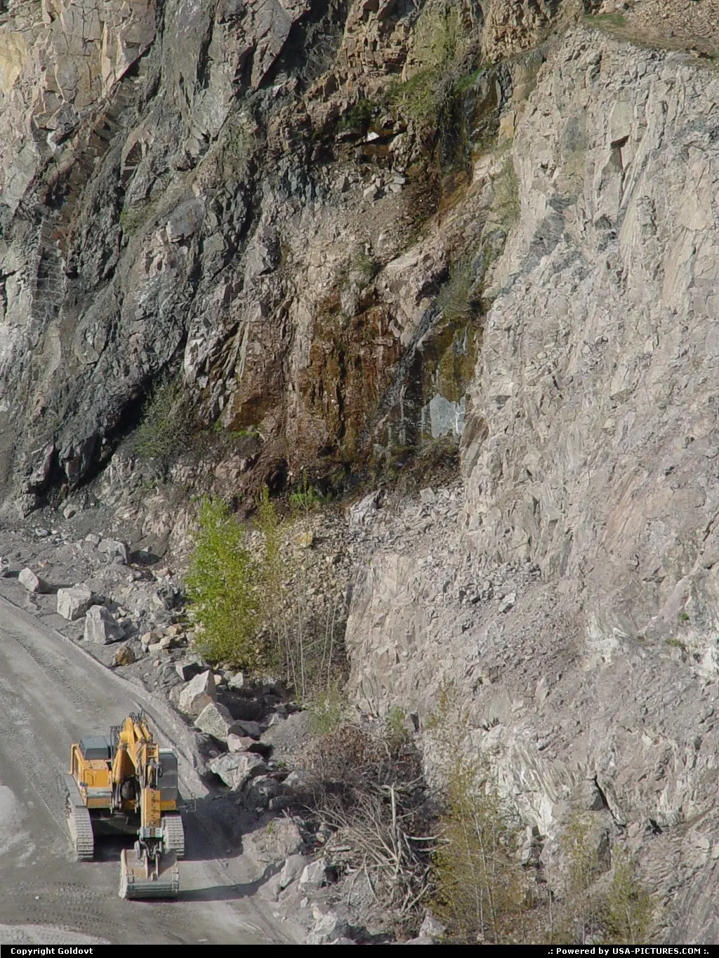An excavator in the quarry.