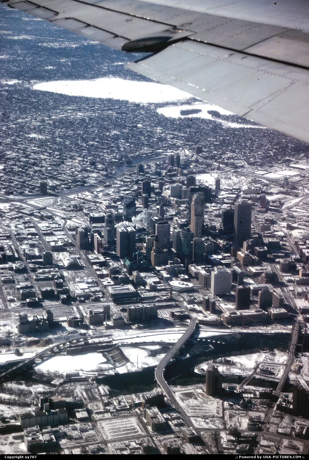 Inexorably getting closer to destination while overflying downtown Minneapolis