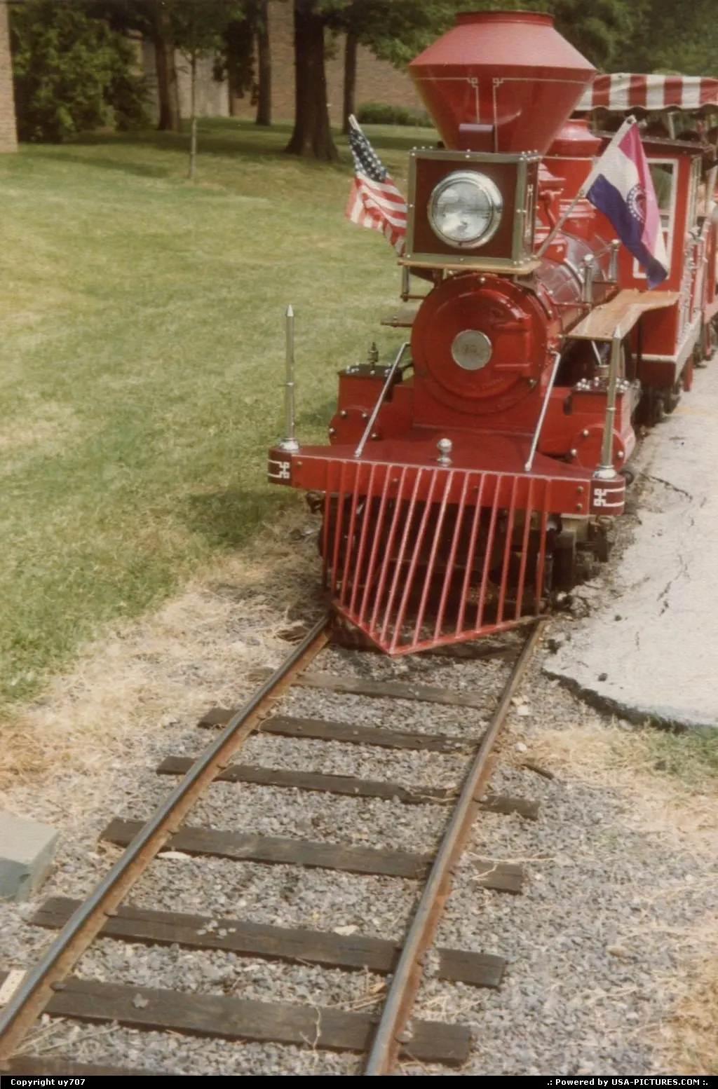 Steam engine of another minitrain right on tracks across Anheuser-Busch's park.