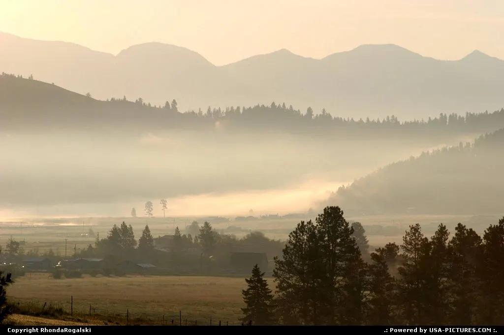 Glowing, misty sunrise in Smith Valley near Kila, Montana.