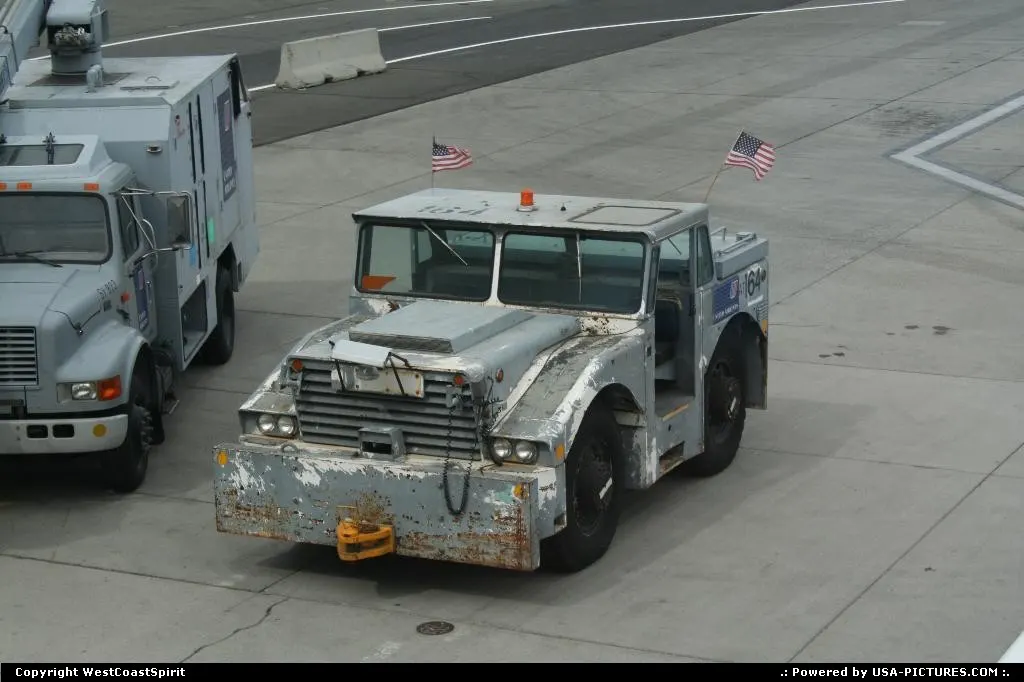 A very funny looking tractor/tug resting in the tarmac in Reno Airport.