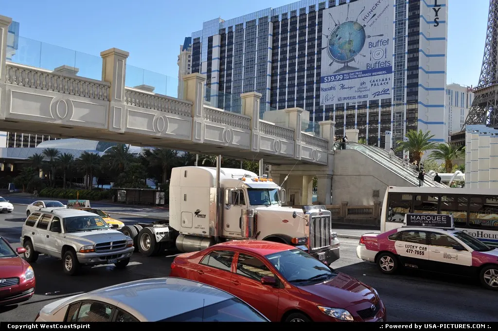 Semi truck by making its way crossing the strip.