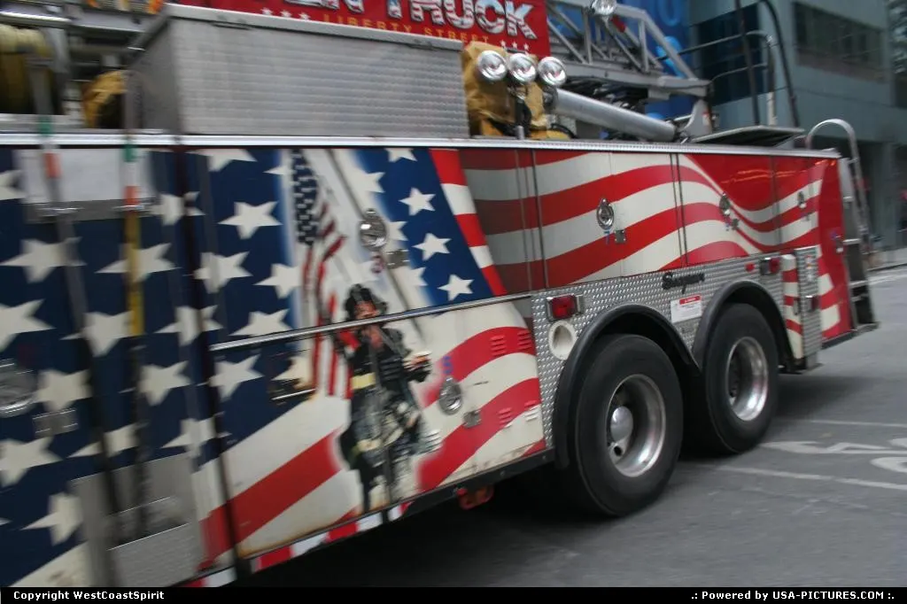 Another vibrant firemen truck roaming around Time Square