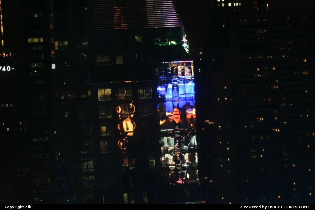 Times square signe light reflect into a building.