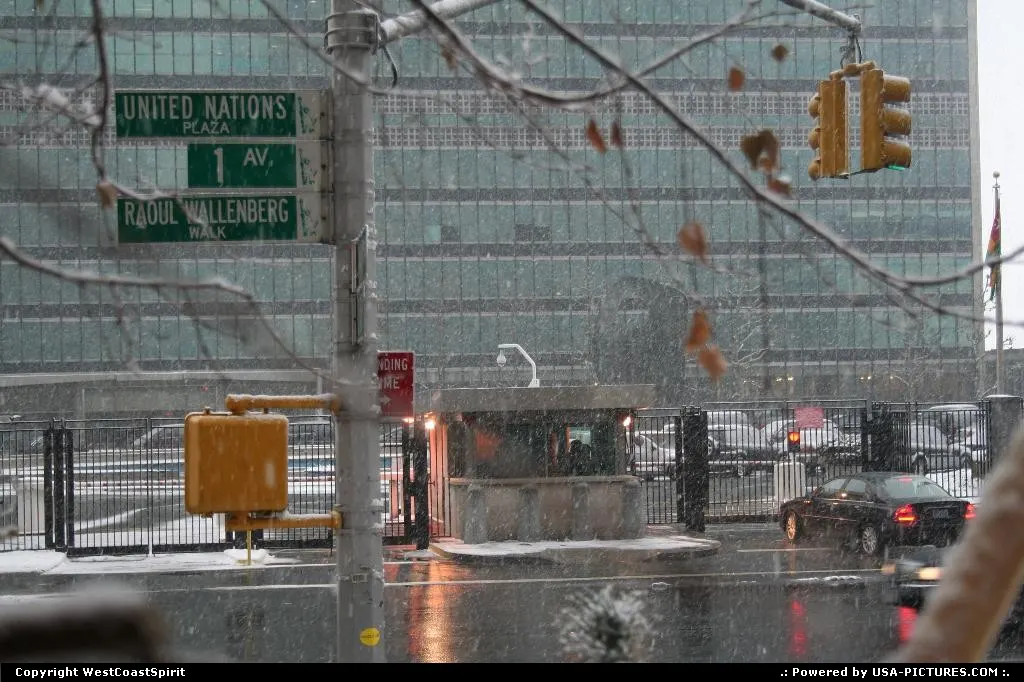 United Nations front gate under the snow. East river is behind.