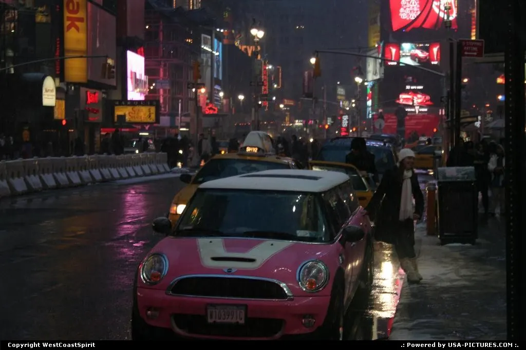 A Mini Cooper (Limo version) in Times Square by night and under the snow.