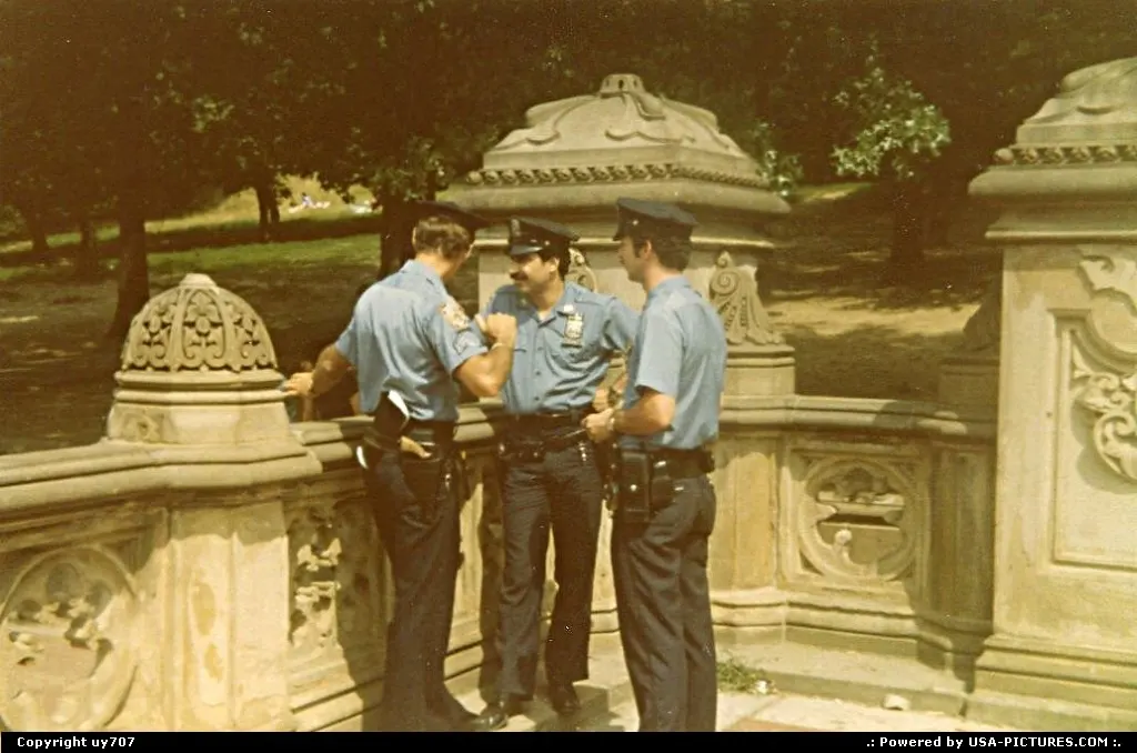 A trio of NYPD members enjoying a pause during a long patrol round.