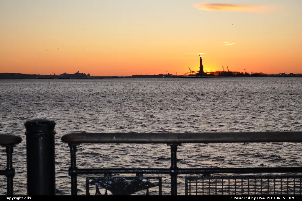 Statue of liberty, sunset from battery park