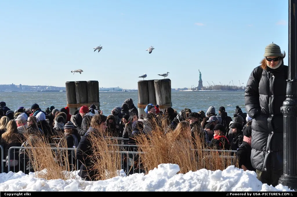 Waiting in a very cold wind to visit miss liberty !!