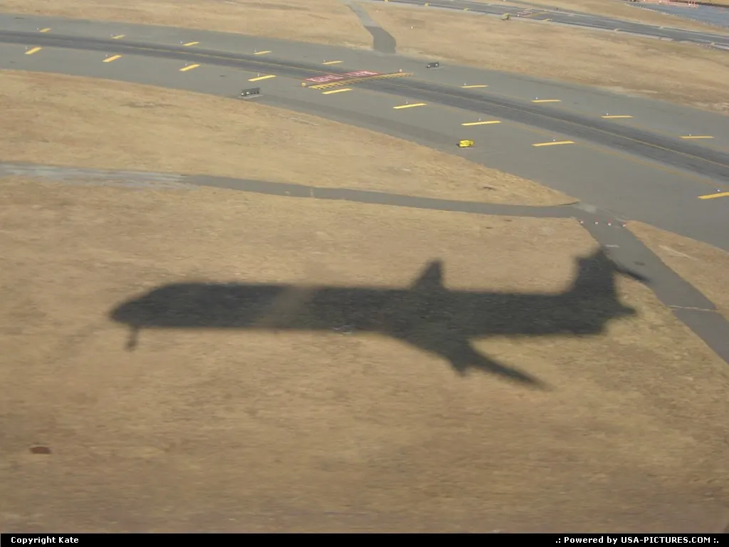 Landing on JFK runway 31R aboard DELTA AL MD-88 N924DL, our shadow will soon merge with...