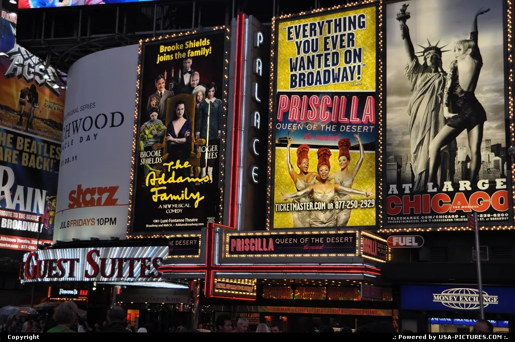 Time Square lighting and broadway shows ads in the heat of July.
