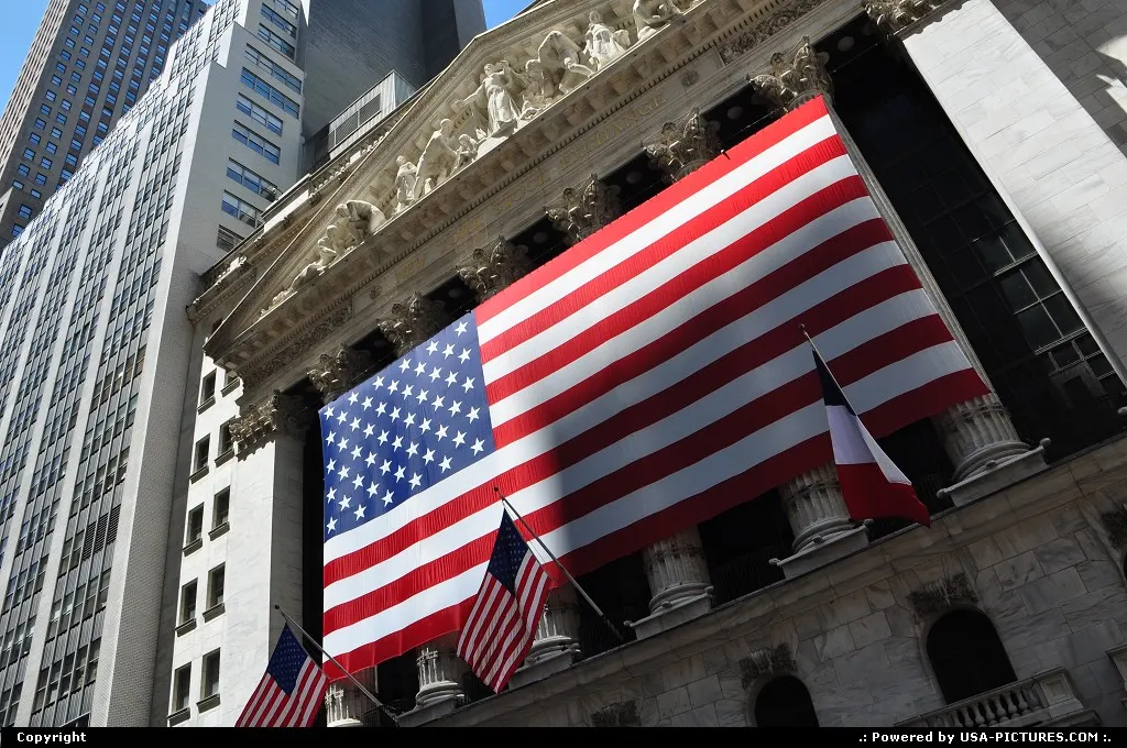 Famous Wall Street / NYSE entrance, with the USA flag streched-on.