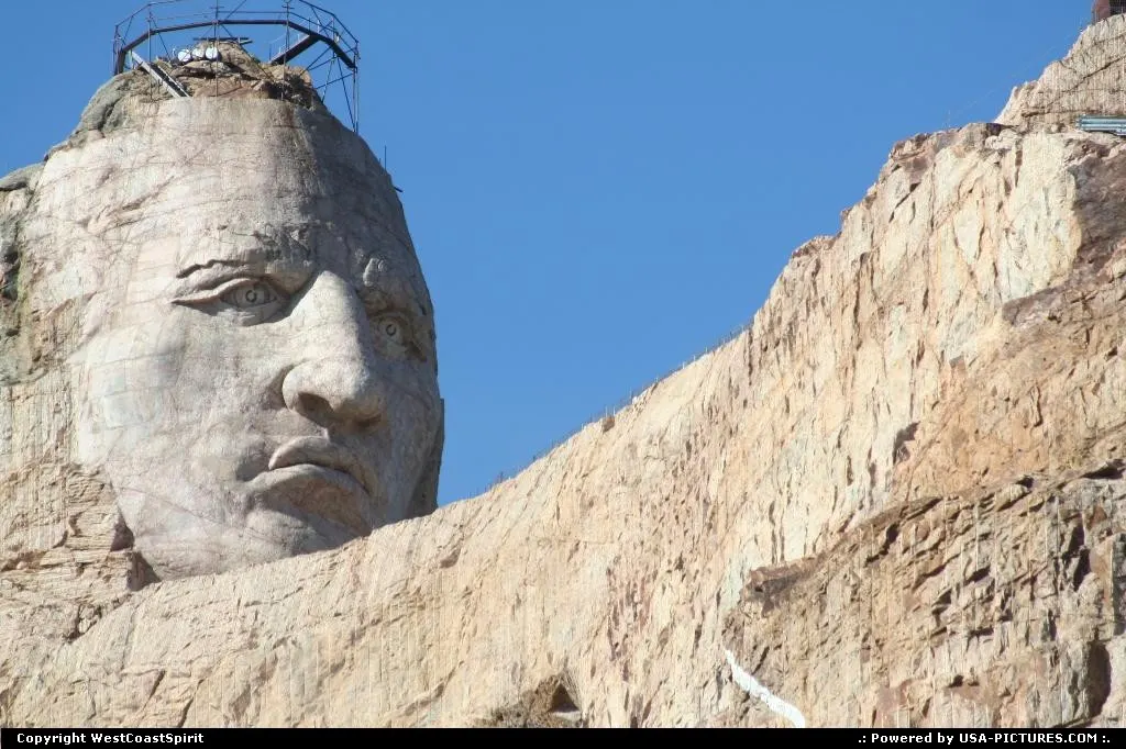The impressive face of Crazy Horse, carved in the mountain.