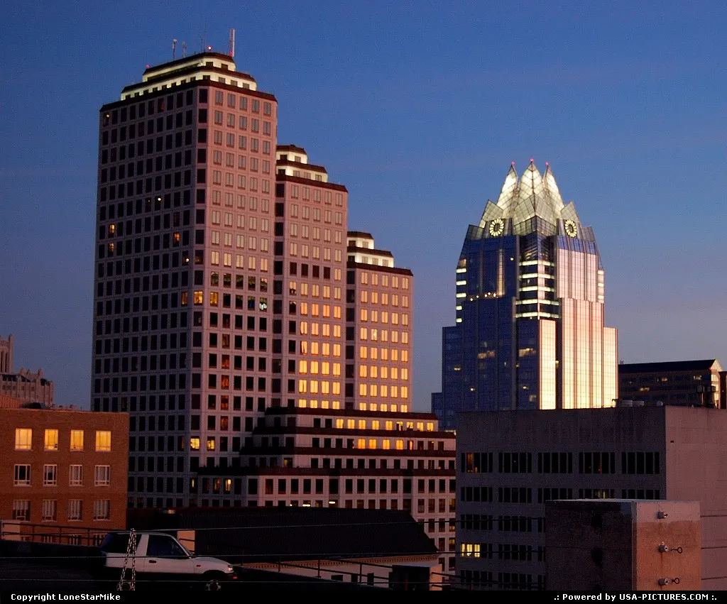 One American Center (left) and Frost Bank Tower (right)at dusk from J.