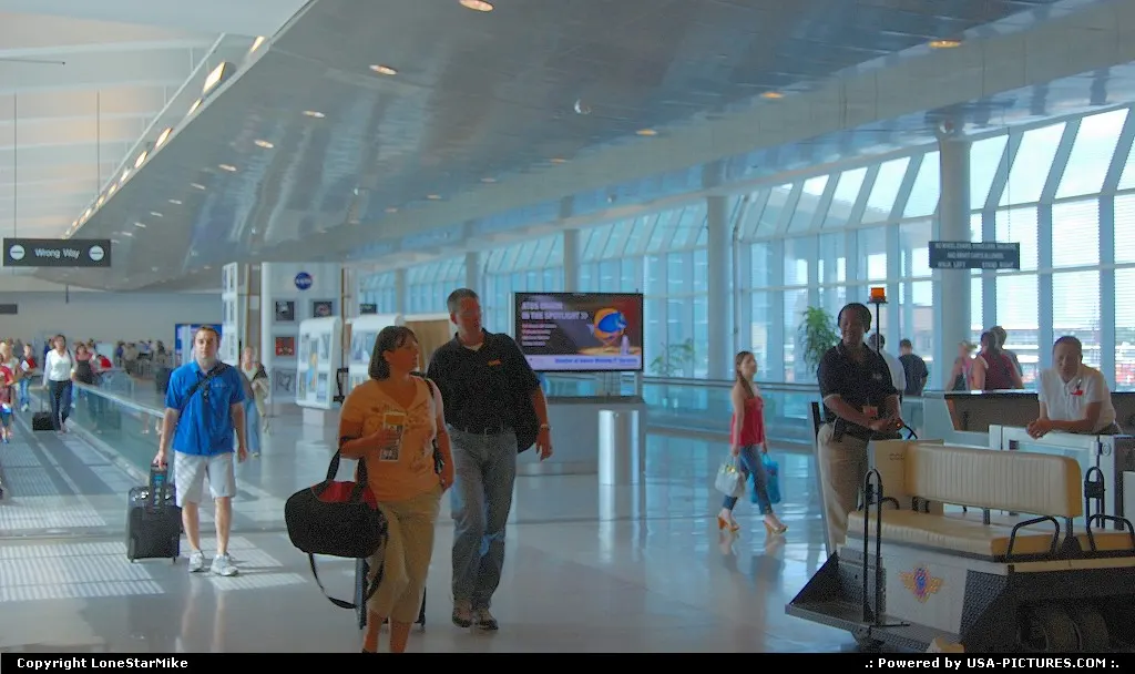 Walkway connecting main terminal to passenger concourse at Houston Hobby Airport
