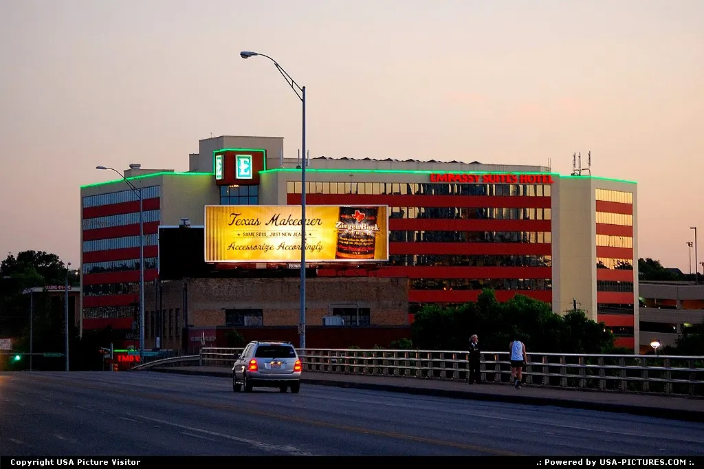 Embassy Suites Hotel on Barton Springs Rd. The Congress Ave Bridge is in the foreground.