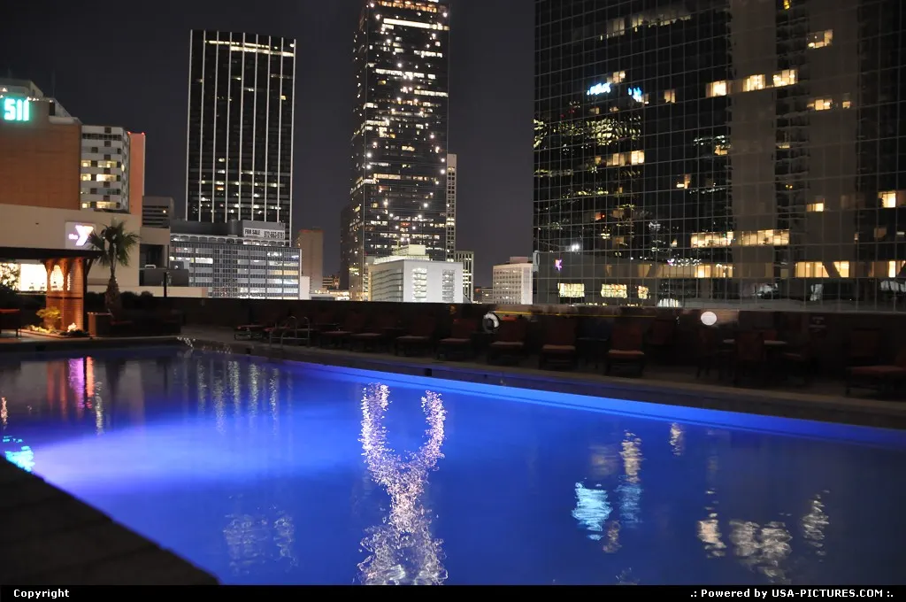 The famous Renaissance Tower in Dallas reflecting in Fairmont hotel pool.