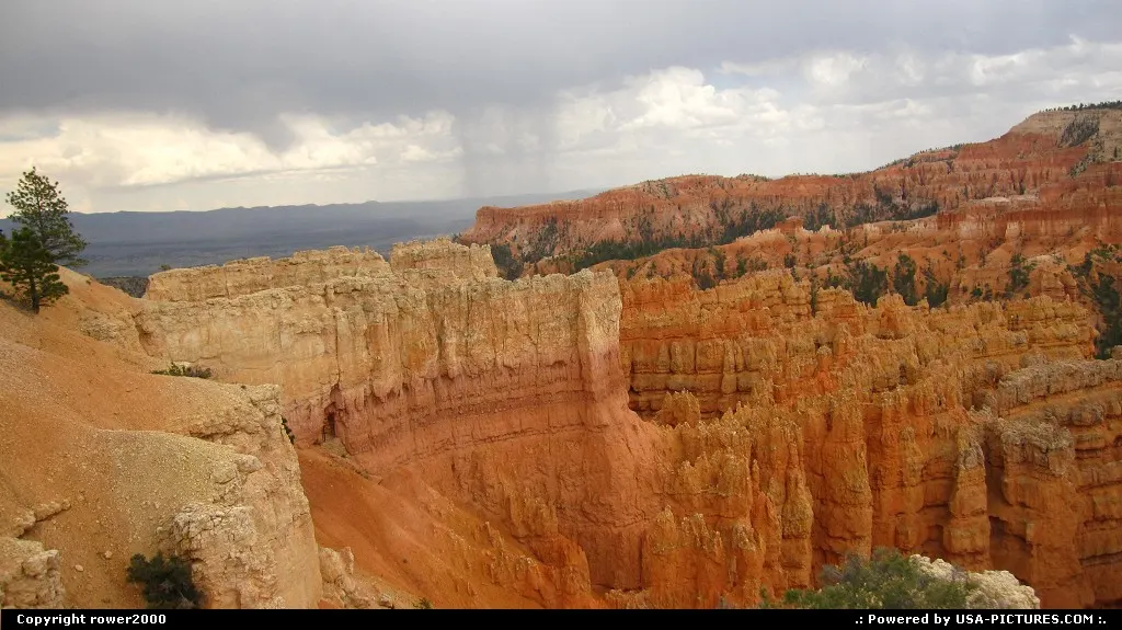Bryce Canyon Amphitheater with rain showers in the background.
