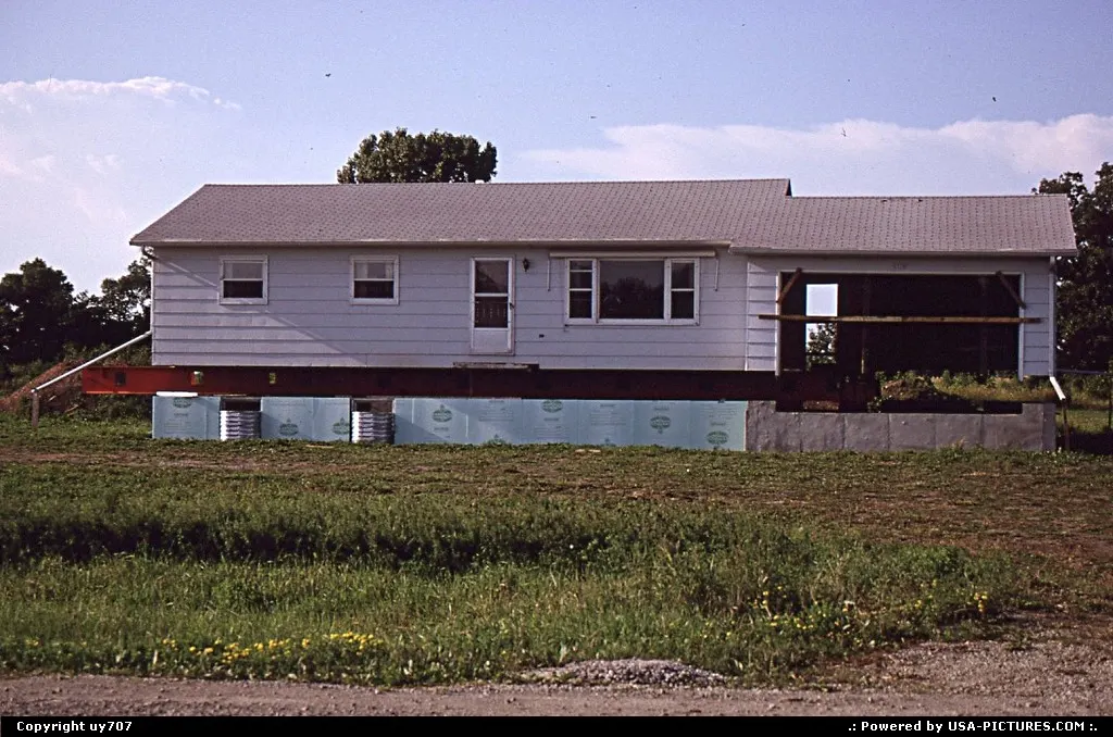 Somewhere around Oshkosh, a house undergoing a major facelift.