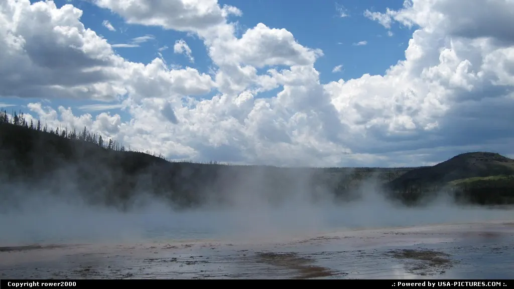 Water vapor rises out of the Grand Prismatic Spring.